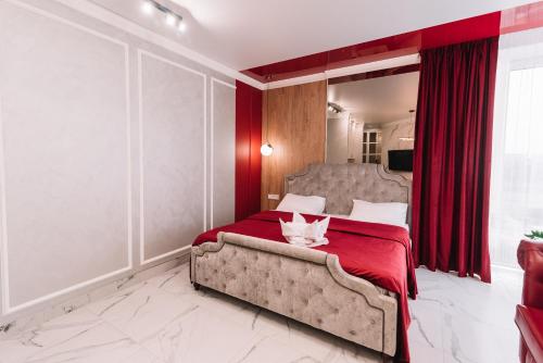 Ένα ή περισσότερα κρεβάτια σε δωμάτιο στο Royal Tower VIP Smart Apartments 4