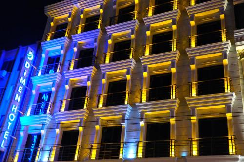 a building with blue and white lights on it at Dimen Hotel in Bursa