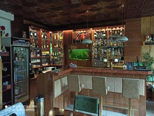 a bar in a restaurant with chairs and a counter at Penzion U Bernardýna in Tachov
