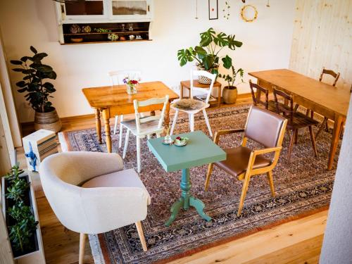 a dining room with chairs and a table and a rug at Krone Lautlingen in Albstadt