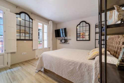 En eller flere senge i et værelse på Suite Capitán 3