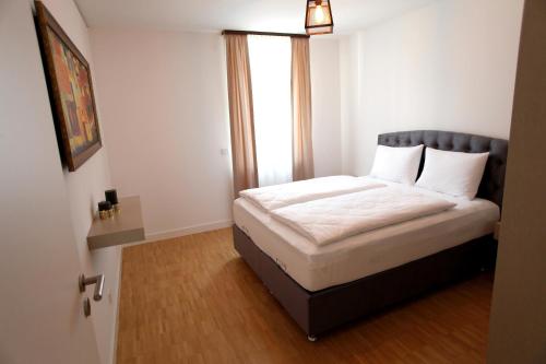 Katil atau katil-katil dalam bilik di Boardinghotel Westarkaden Suites