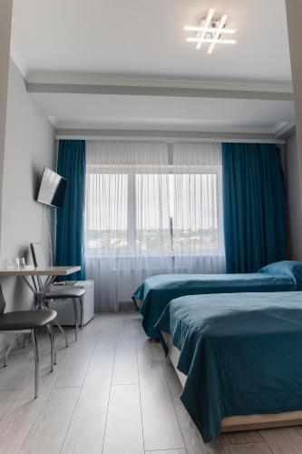 Postel nebo postele na pokoji v ubytování AF TRANS Hotel