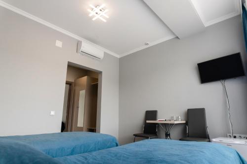 TV a/nebo společenská místnost v ubytování AF TRANS Hotel