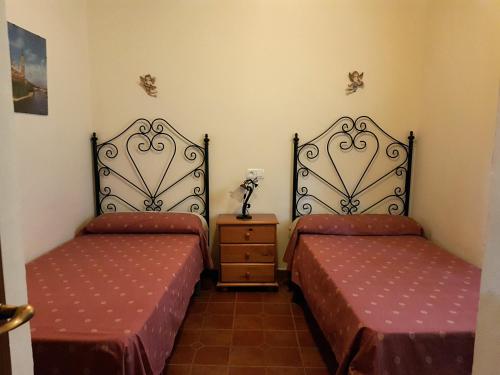 Postel nebo postele na pokoji v ubytování Cortijo Porroncico