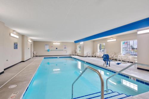 a large swimming pool in a hotel room at Cobblestone Hotel & Suites - Austin in Austin