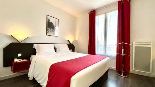 a bedroom with a large bed with red curtains at Boulogne Résidence Hotel in Boulogne-Billancourt