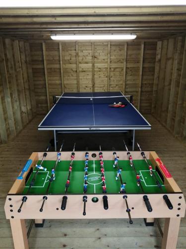 a ping pong table in a room with a table top at Four Winds,Kinsale Town,Exquisite holiday homes,sleeps 26 in Kinsale