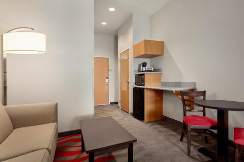 a living room with a couch and a table at Comfort Suites Boise West Meridian in Meridian