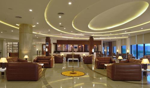 a lobby with couches and tables in a building at Fortune Select Grand Ridge, Tirupati - Member ITC's Hotel Group in Tirupati