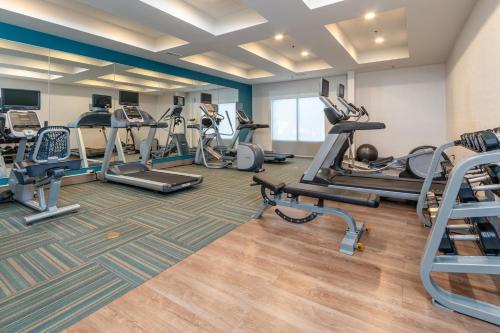 a fitness room with treadmills and cardio machines at Holiday Inn Express & Suites Tupelo by IHG in Tupelo