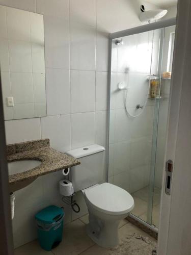 a bathroom with a shower and a toilet and a sink at Casa paraíso 2 in Arraial do Cabo