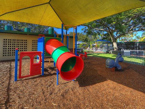 a playground with a slide in a park at Anchorage Holiday Park in Iluka