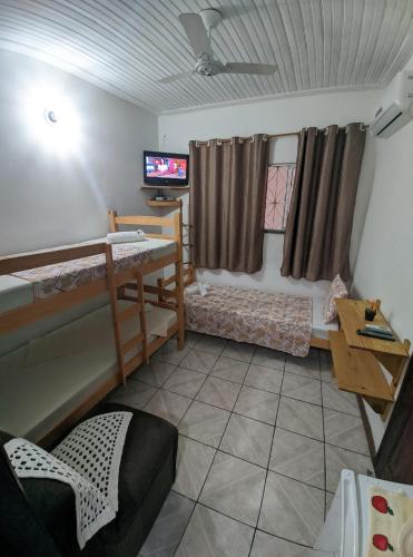 Postel nebo postele na pokoji v ubytování Casa Thayla Pousada
