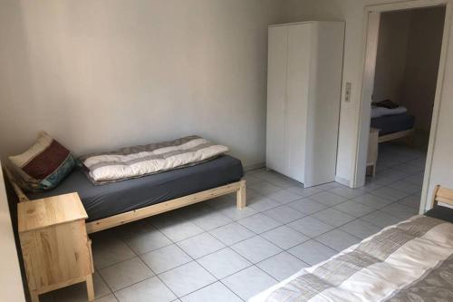 a bedroom with two beds in a room at room for four in Alzenau in Unterfranken