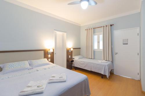 Кровать или кровати в номере Pousada da Chácara