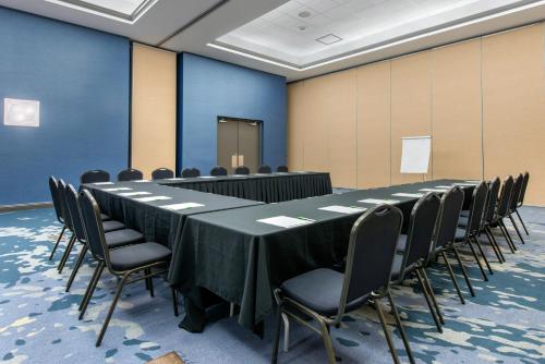 a conference room with a long table and chairs at Holiday Inn Melbourne-Viera Conference Ctr by IHG in Melbourne