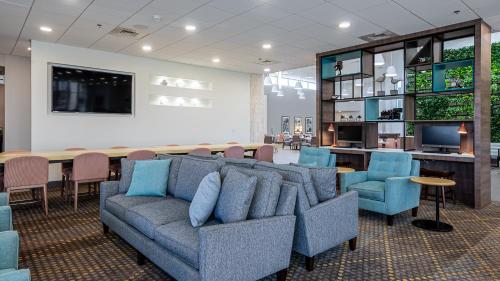 a living room with a couch and chairs and a table at Holiday Inn Panama City, an IHG Hotel in Panama City