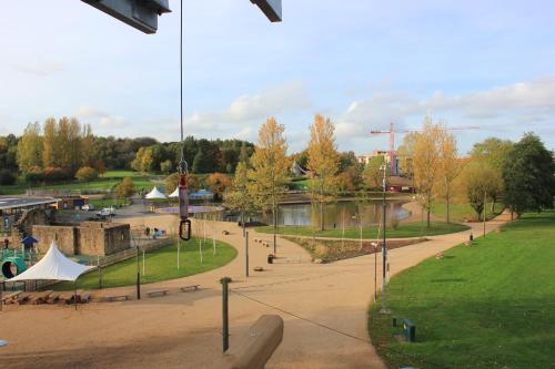 a park with a body of water and a river at Holiday Inn Telford Ironbridge by IHG in Telford
