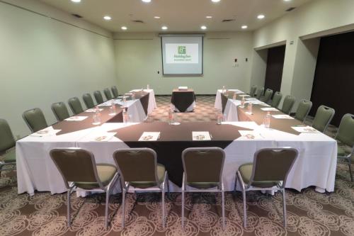 a conference room with a long table and chairs at Holiday Inn Monterrey Norte by IHG in Monterrey