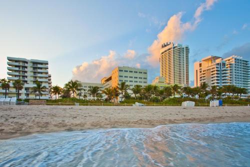 a view of a beach with buildings in the background at Holiday Inn Miami Beach-Oceanfront by IHG in Miami Beach