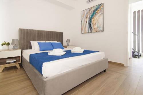 a bedroom with a large bed with two hats on it at Villa Medusa in Protaras