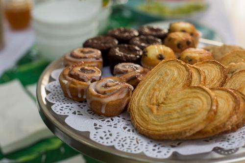 a tray of donuts and other pastries on a plate at Anjali Casa Divina in Sayulita