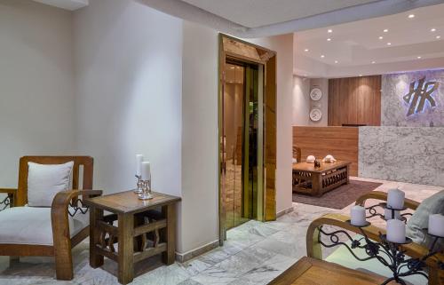 a living room with a table and a dining room at Hotel Riazor in Santo Domingo