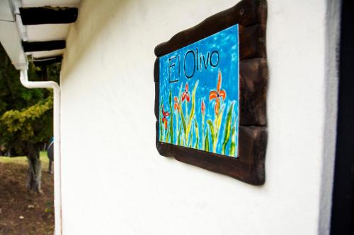 a sign on the side of a building at Villa Patty in Tibasosa