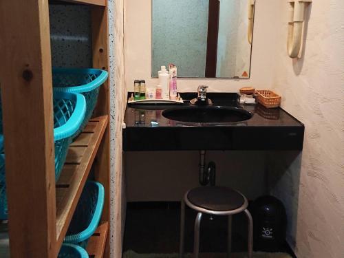 a bathroom with a sink and a mirror at Cooking inn Kagetsu - Vacation STAY 88535 in Kuradani