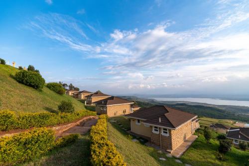 a row of houses on top of a hill at Lake Elementaita Mountain Lodge in Nakuru