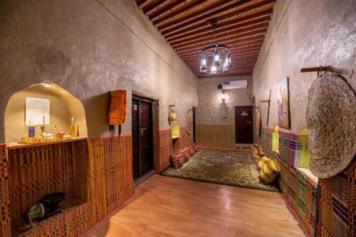 a hallway of a building with a room with at Antique Inn in Nizwa