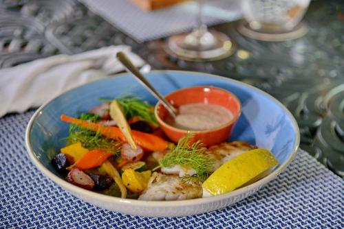 a bowl of food sitting on a table at Courtyard Hotel Gqeberha in Port Elizabeth