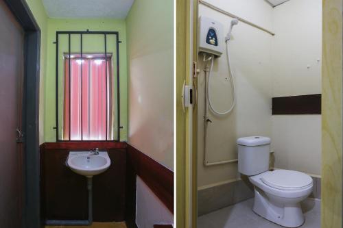 哥打巴魯的住宿－Impiana Hotel，一间带卫生间和水槽的浴室