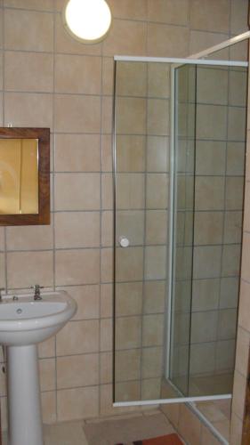 a bathroom with a shower and a sink at Seeheim Hotel in Seeheim