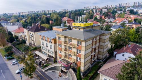 an overhead view of a building in a city at City Hotel Miskolc in Miskolc