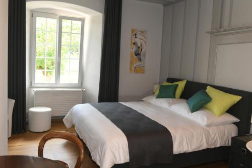 Кровать или кровати в номере Auberge de Bellelay
