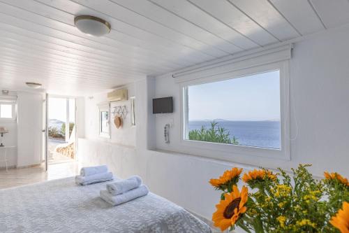 Postel nebo postele na pokoji v ubytování Sea Wind Apartments