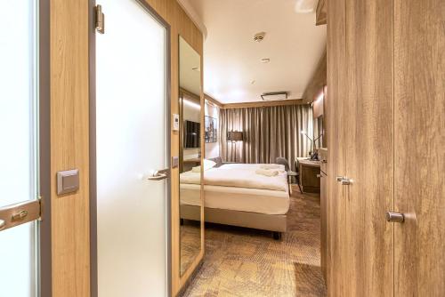 Ένα ή περισσότερα κρεβάτια σε δωμάτιο στο Park Inn By Radisson Wismar