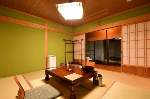 a room with a table with a computer on it at 高野山 宿坊 不動院 -Koyasan Shukubo Fudoin- in Koyasan