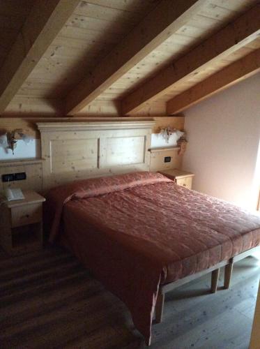 Un ou plusieurs lits dans un hébergement de l'établissement Residence Garnì Il Giglio
