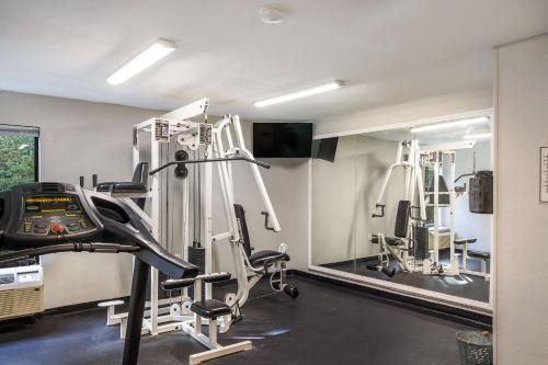 a gym with several tread machines in a room at Quality Inn near MCAS Cherry Point in Havelock