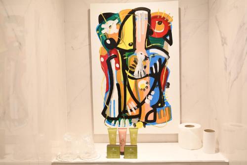 a painting of a lion on a shelf in a room at Hotel Aida Opera in Paris