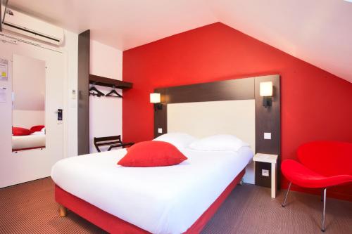 Katil atau katil-katil dalam bilik di KYRIAD ROUEN NORD - Mont Saint Aignan