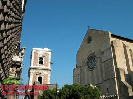 a tall building with a clock tower in a city at B&B Historic Centre Naples in Naples
