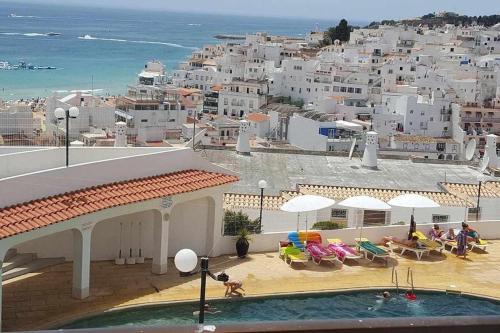 a view of a resort with a swimming pool and the ocean at Albufeira, Ocean terrace (22) in Albufeira