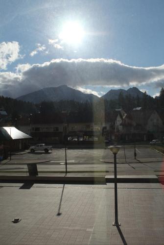 a view of a parking lot with mountains in the background at Sweet Apartments in Žabljak