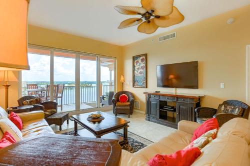 a living room with a couch and a flat screen tv at 801 Harborview Grande in Clearwater Beach