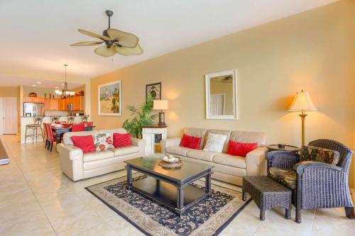 a living room with two couches and a table at 801 Harborview Grande in Clearwater Beach