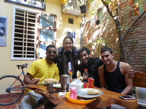 a group of people sitting at a table at Nha Lan Homestay in Hoi An